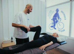 Woman having her knee and hips manipulated as part of a shin splints physio appointment